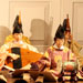 Gagaku Ensemble performers on stage, one playing the biwa