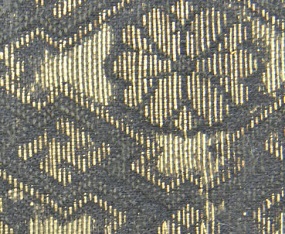 A micrograph of an area of damaged and weak silk threads