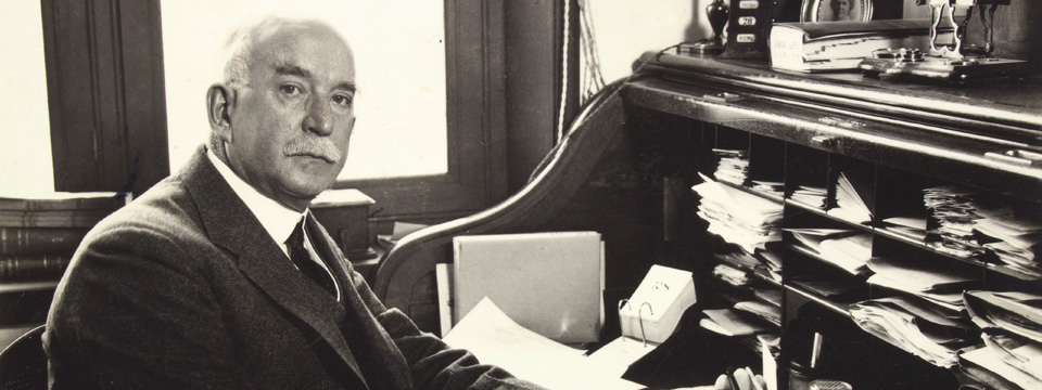 John C. Ferguson at his desk, undated.   John Calvin Ferguson Family Papers